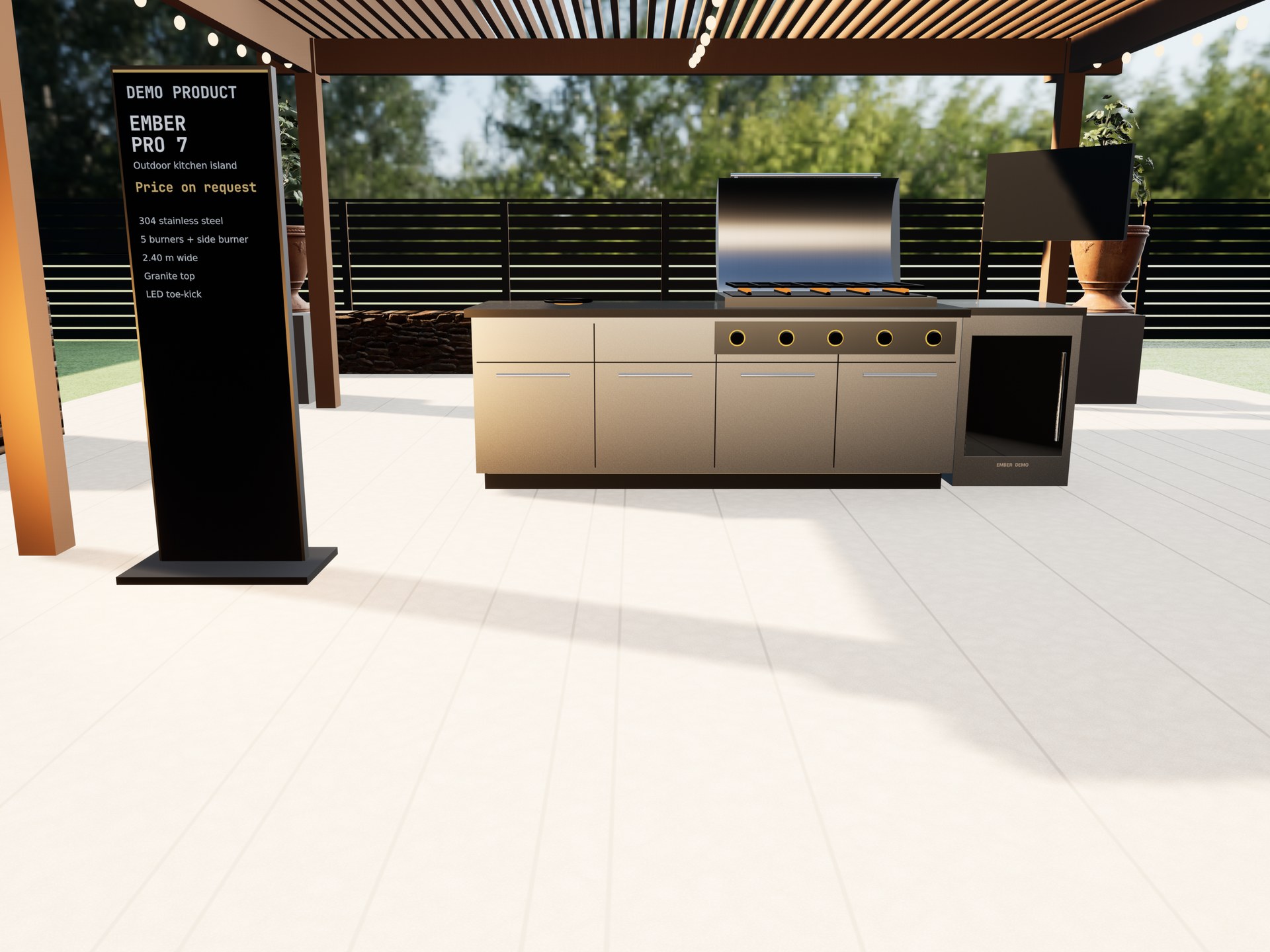 Demo showroom: an outdoor kitchen island at full scale under a timber pergola, beside a spec stand for the Ember Pro 7.